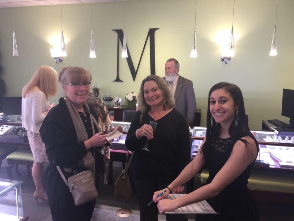 women-at-event-in-jewelry-store